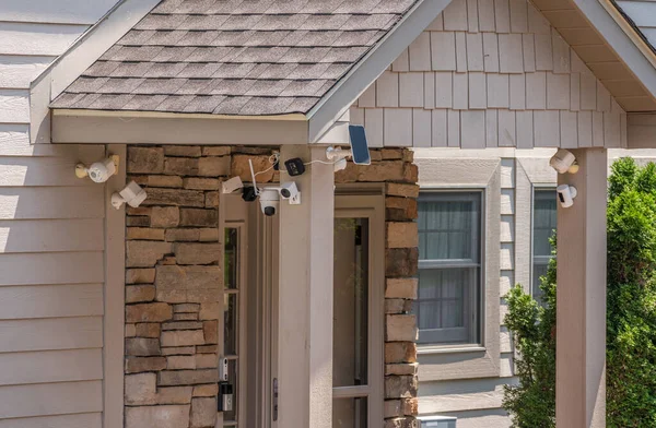 Multiple cameras and sensors securing front door of home — Stock Photo, Image