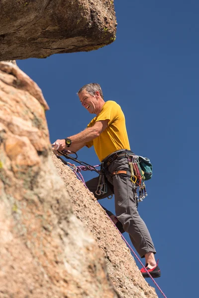 Senior man at top of rock climb in Colorado — Stock Photo, Image