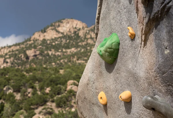 Climbing wall with mountains in background — Stock Photo, Image