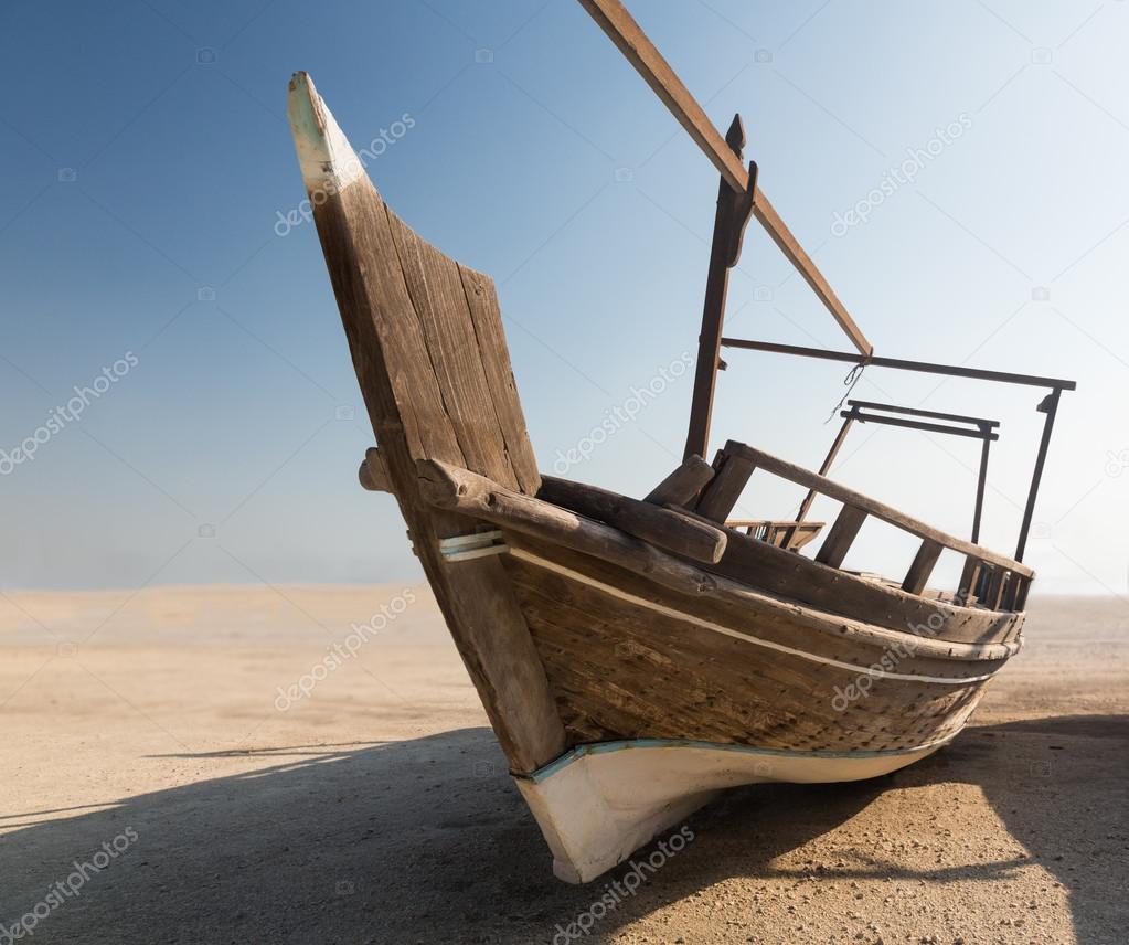 Fishermans boat or dhow on sand
