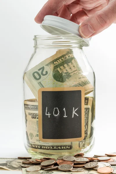 Hand opening glass Jar used for 401K fund — Stock Photo, Image