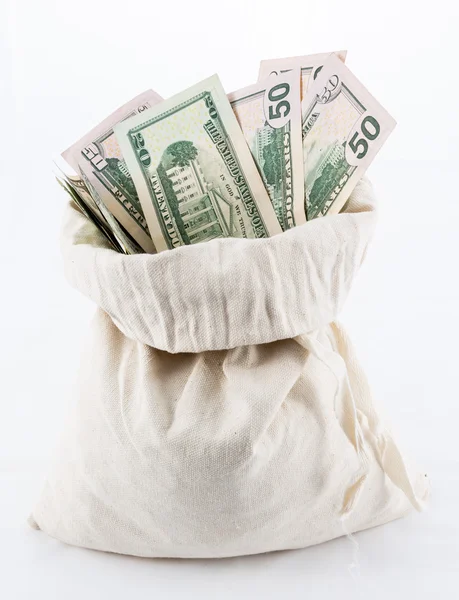 Many US dollar bills or notes with money bags — Stock Photo, Image