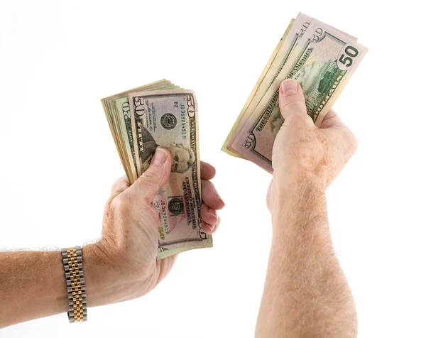 Caucásicas manos étnicas sosteniendo ventilador de billetes de dólar — Foto de Stock