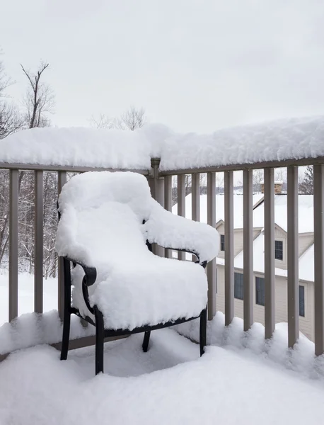 Outdoors garden chair buried in snow drift — Stock Photo, Image