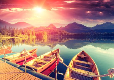 Wooden boats on majestic mountain lake