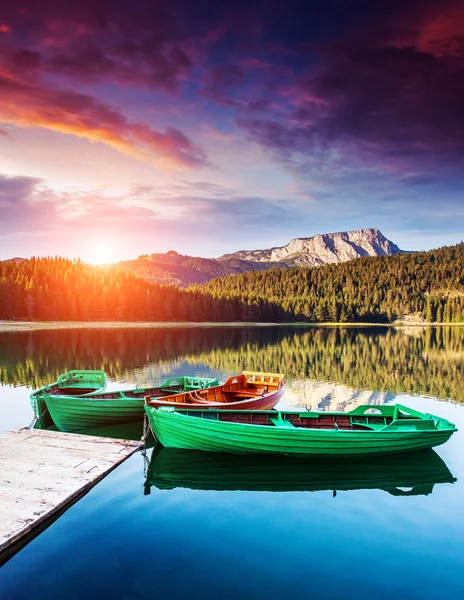 Boats on Black lake in Durmitor national park — стокове фото