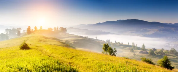Foggy day and hills by sunlight. — Stock Photo, Image