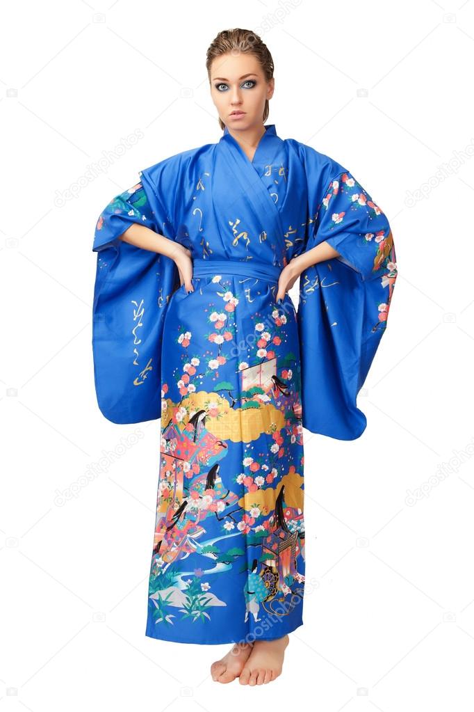 Young woman in Japanese kimono isolated on white background.
