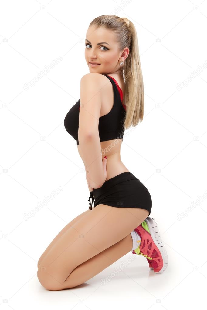 Pretty woman in black active wear on white background.