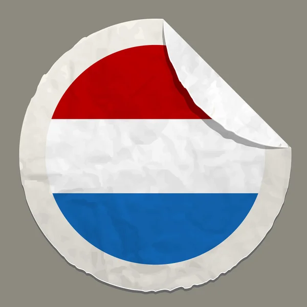 Bandera de los Países Bajos en una etiqueta de papel — Vector de stock