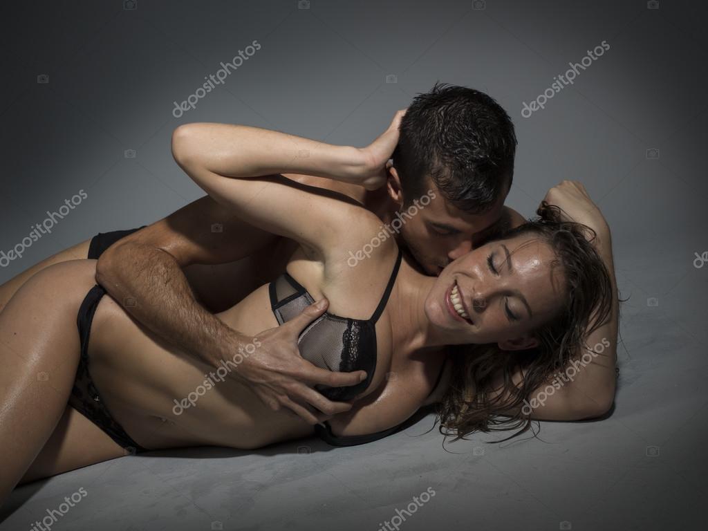 Couple in lingerie having sex laying on the floor Stock Photo by ©Immfocus 105819966