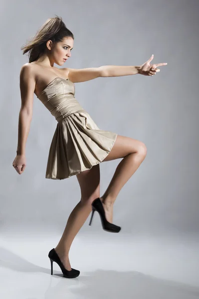 Fashionable young model posing with trendy clothes — Stock Photo, Image