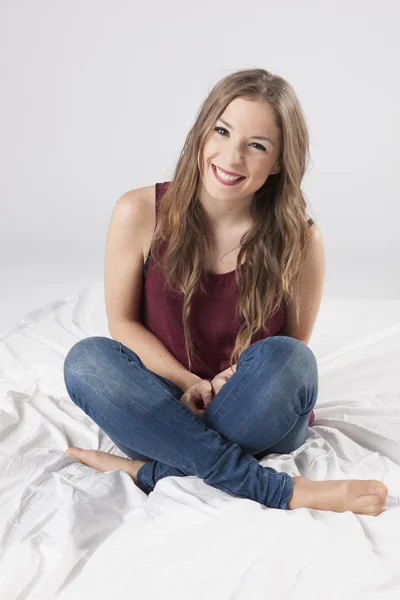 Stylish young woman posing in clear background — Stock Photo, Image