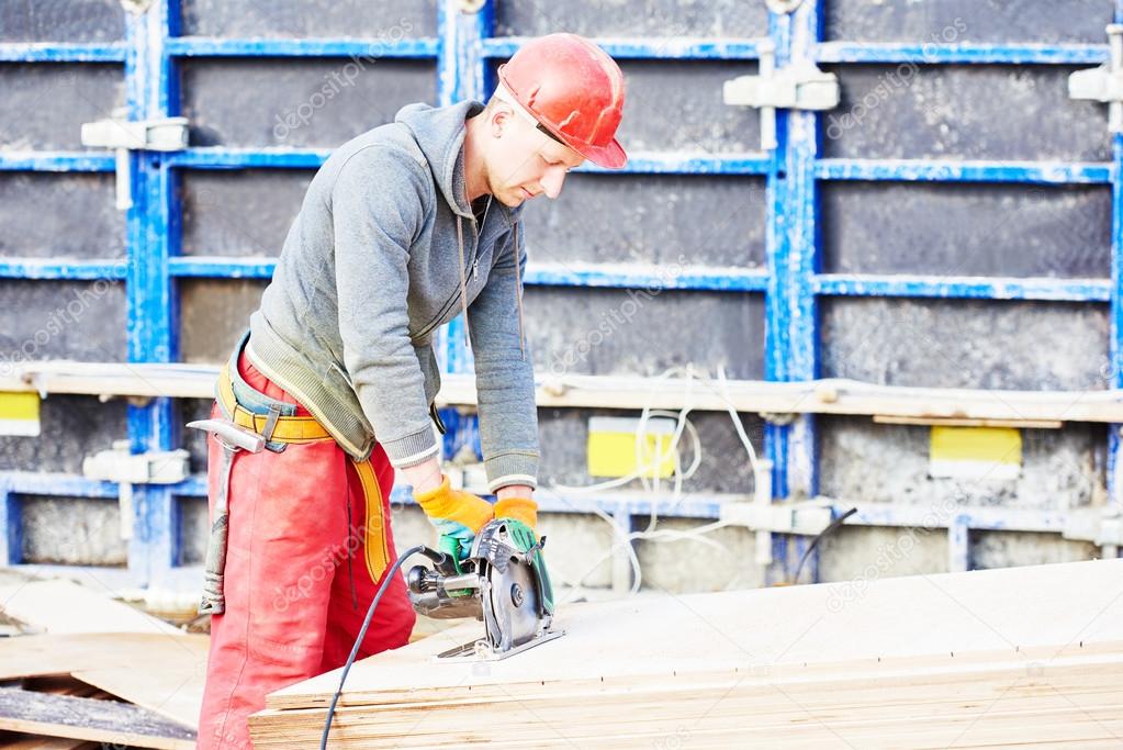 worker carpenter joiner at building site