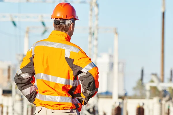 Service engineer standing at heat electropower station — Stock Photo, Image