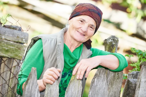 Portrait of old countrywoman outdoors — Stock Photo, Image