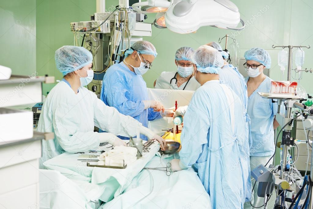 surgeons team at cardiac surgery operation