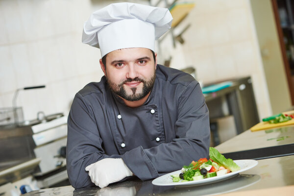 Male cook chef portrait in restaurant commercial kitchen
