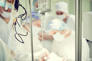 surgery and surgical operation. Mediacal dropper with anesthetics