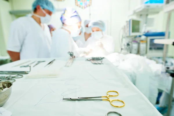 Surgery and surgical tools at surgion operation in hospital — Stock Photo, Image