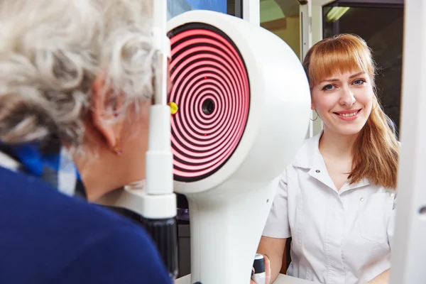 Ophthalmology. senior woman patient under sight testing in clinic — Stock Photo, Image