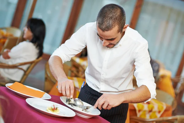 Waiter man dressing fish at restaurant — Stock Photo, Image