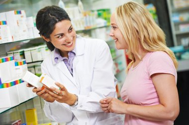 Pharmacy chemist and customer in drugstore clipart