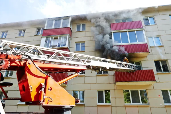 Fireman during extinguish a fire — Stock Photo, Image