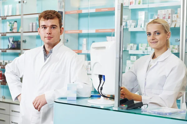 Pharmaceutical workers in drugstore — Stock Photo, Image