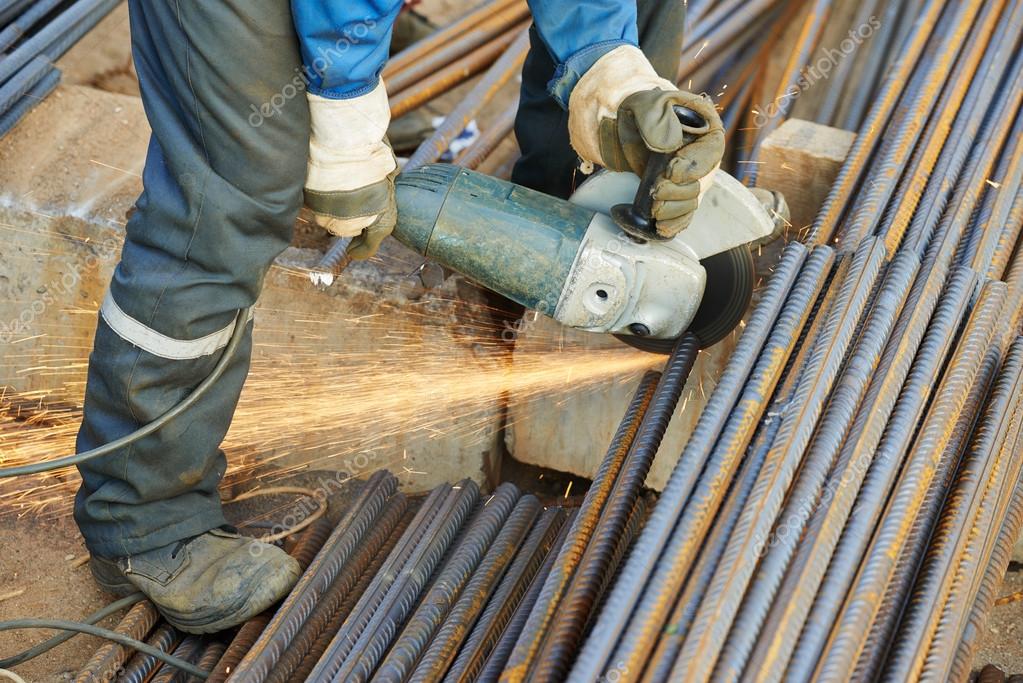 Worker cutting rebar by grinding machine Stock Photo by ©kalinovsky