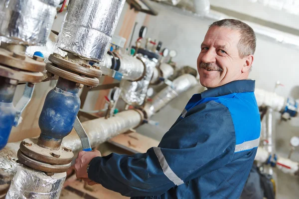 Heating engineer repairman in boiler room — Stock Photo, Image