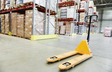 hand pallet stacker truck at warehouse clipart