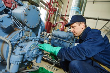 service worker at industrial compressor station clipart