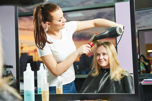 Hairdresser at work. Drying hair — Stock Photo, Image
