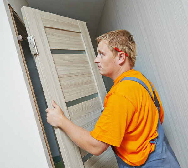 carpenter at door installation