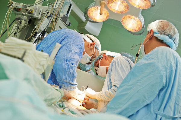 surgeons team at operation