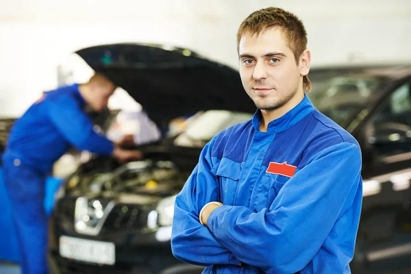 Smiling repairman auto mechanic Stock Photo