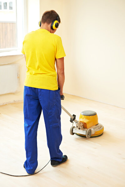 Parquet Floor maintenance by grinding machine