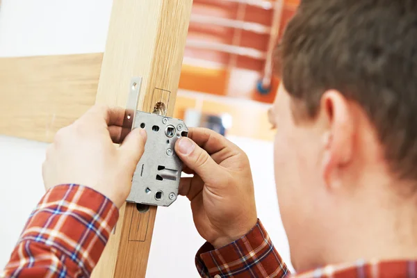 Carpenter at door installation — Stock Photo, Image