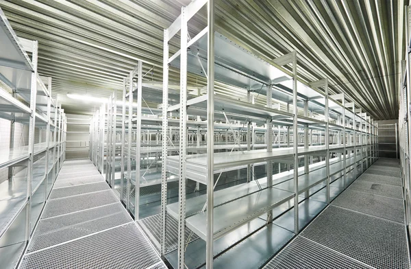 Empty new modern shelves in warehouse — Stock Photo, Image