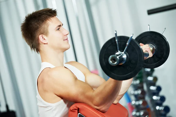 ボディービルダー男トレーニング上腕二頭筋筋肉運動 ストック画像