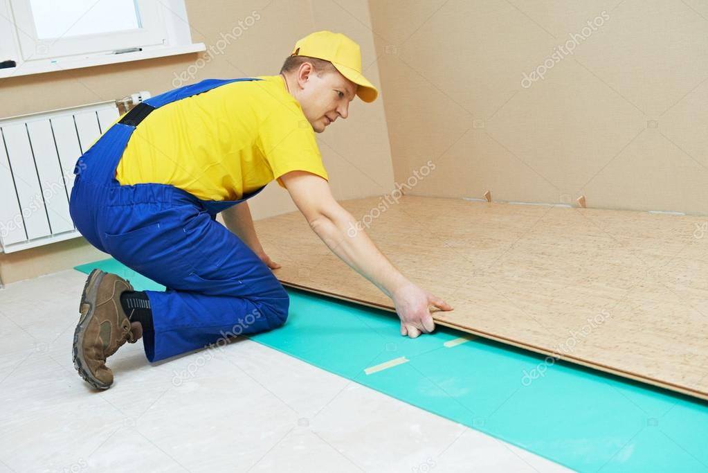 cork worker at flooring work