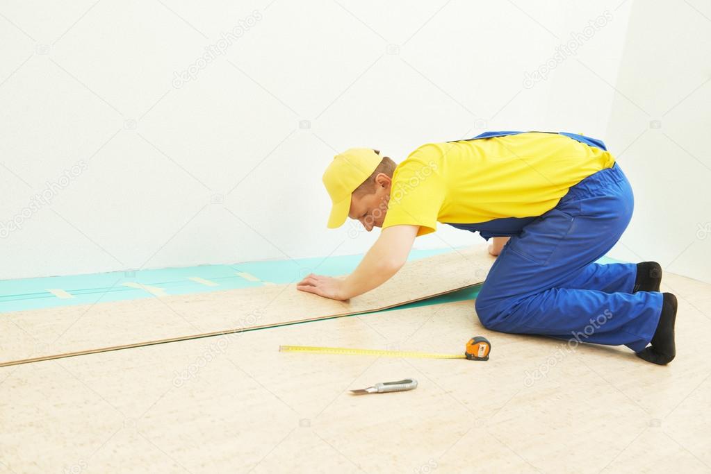 cork worker at flooring work