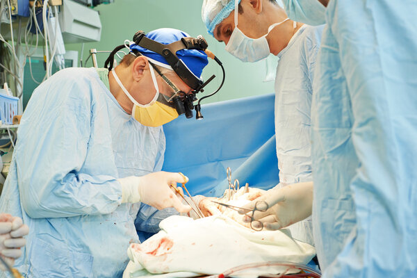 surgeons team at operation