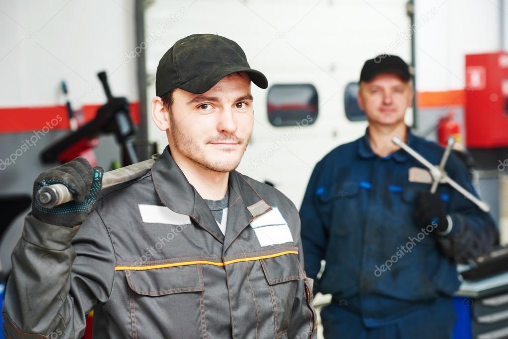 two auto mechanic repairmans