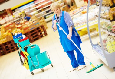 worker cleaning floor with mop clipart