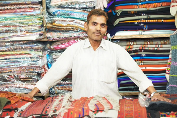 Small shop owner indian man at his souvenir store — Stock Photo, Image