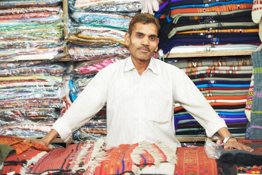 small shop owner indian man at his souvenir store