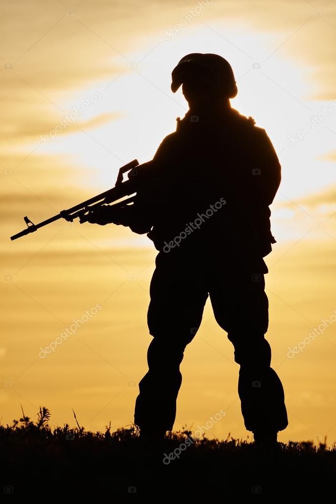 Military soldier silhouette with machine gun 