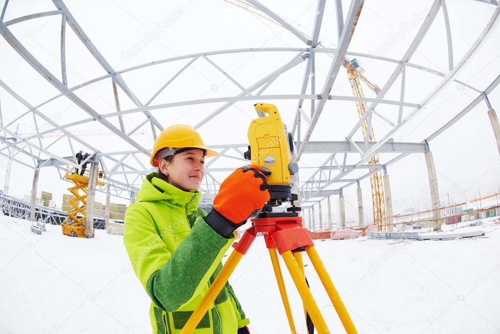 surveyor works with theodolite